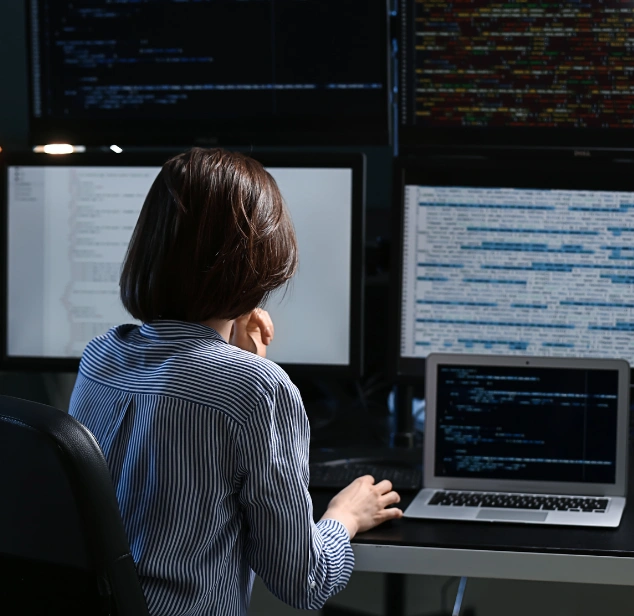 Database engineers reviewing a schema and query performance dashboards